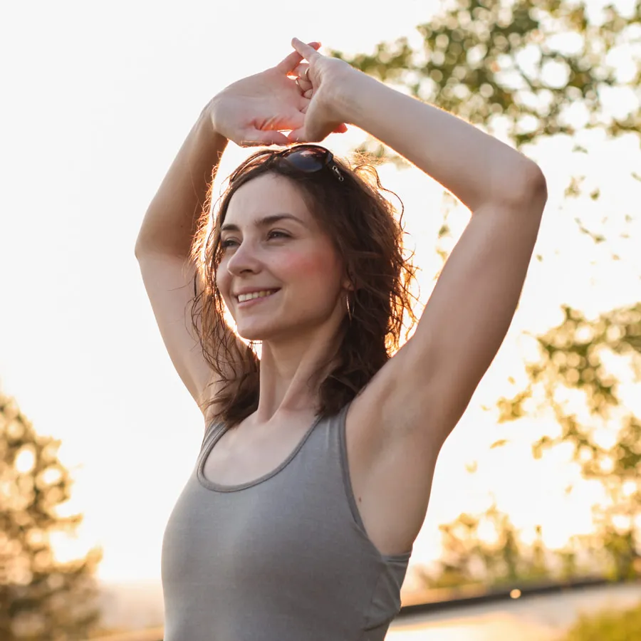 Spirited morning, woman sports exercises in park<br />