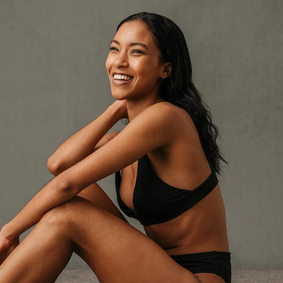 Blonde smiling woman year with clean fresh face and hands wit