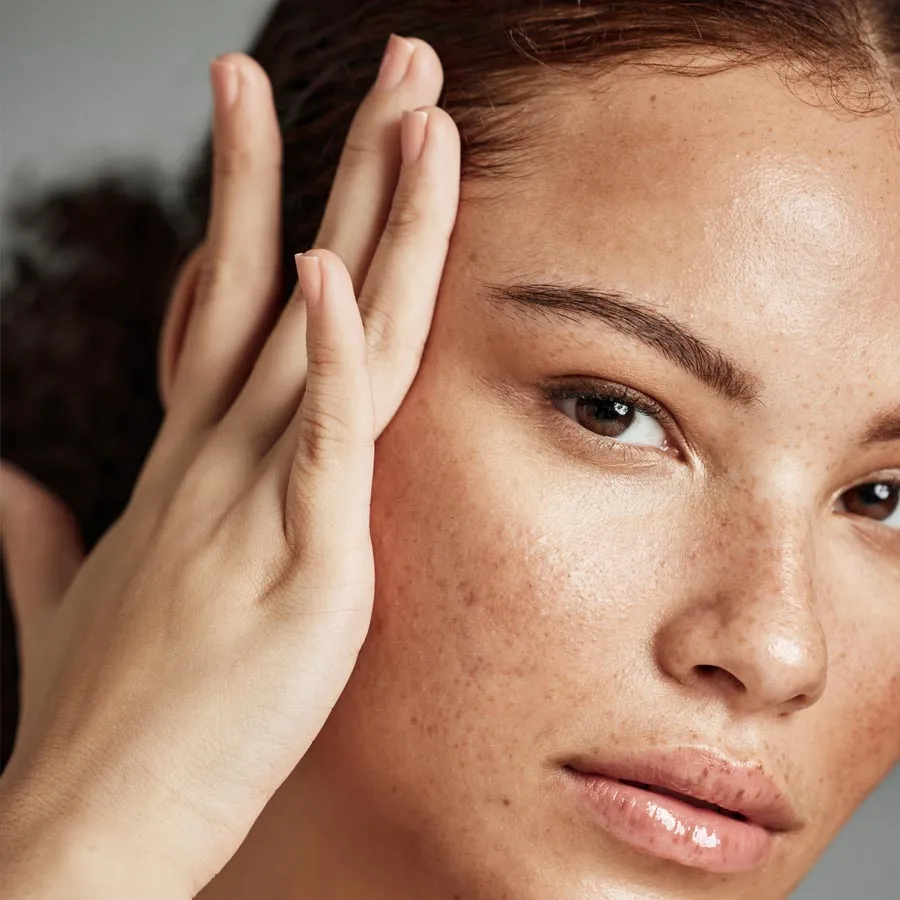 Blonde smiling woman year with clean fresh face and hands wit