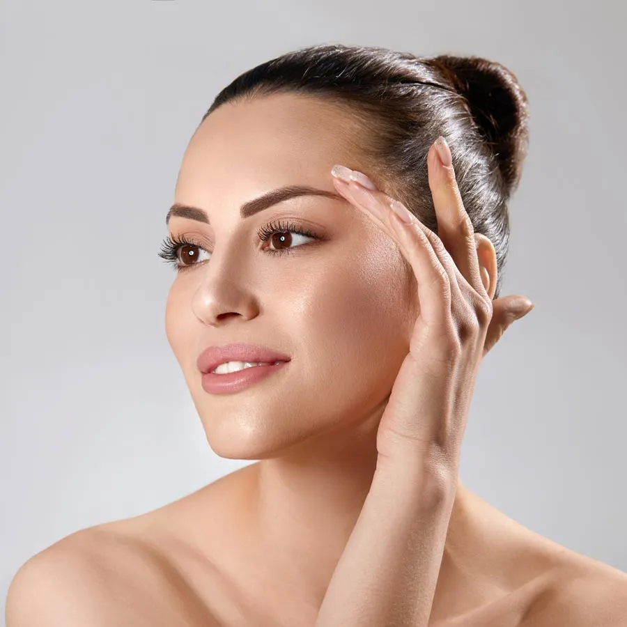 Blonde smiling woman year with clean fresh face and hands wit