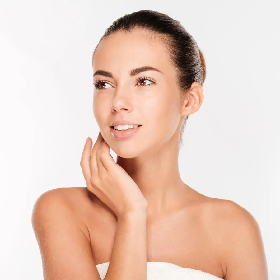 Beauty portrait of a woman with fresh skin looking away